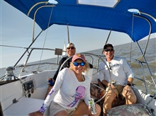 Carl, Roberta and Justin sailing SV Overide