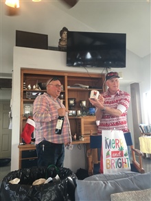 Tom Reynolds showing off his Secret Santa gift